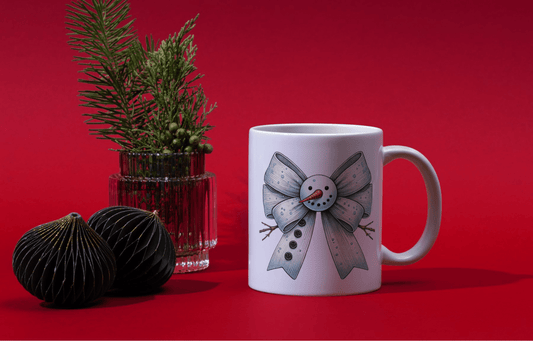 Ink and Charms Designs Mugs Snowman's bow Mug